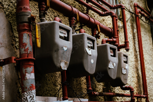 Vintage Industrial Look: Old Gas Meters on a Textured Wall