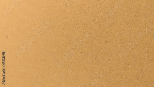 Background of brown kraft paper or cardboard texture. copy space background in beige yellow, brown.
