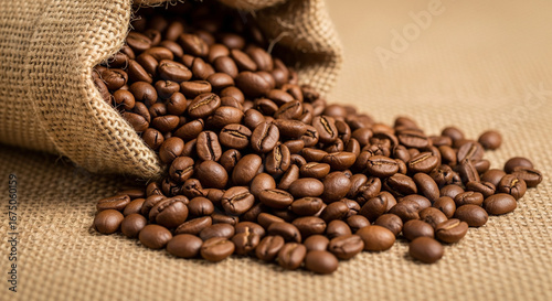 Roasted Coffee Beans Spilling from Burlap Sack onto Burlap Surface