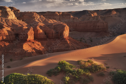 A stunning desert landscape with rocky formations and sand dunes in Mongolia