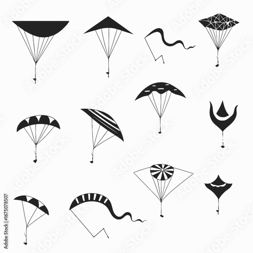 Array of whimsical kites soaring high up black and white silhouette