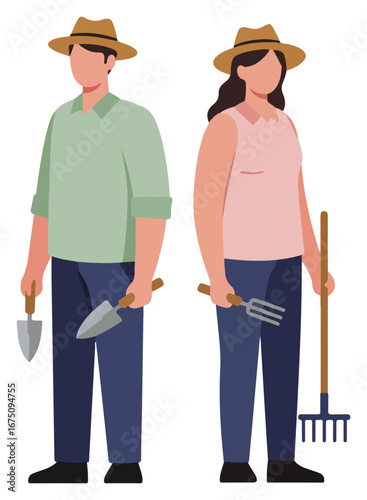 A man and woman farmer stand proudly, holding gardening tools, ready for work in the fields.