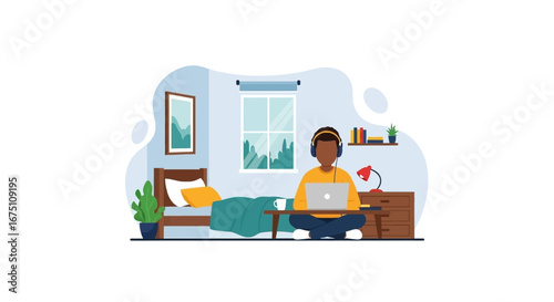 Young man working remotely on a laptop at home, sitting comfortably with headphones. Illustrates modern flexible work, study, and lifestyle concepts.