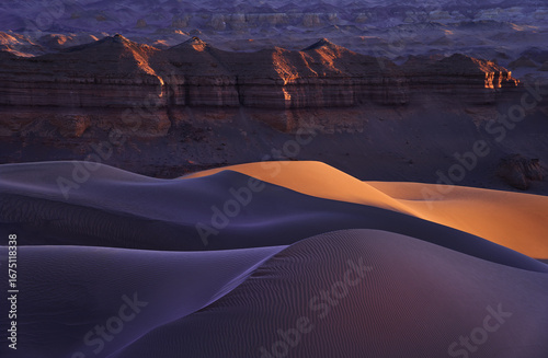 The Mesmerizing Sand Dunes bathed in Sunset Glow within Desert Landscape