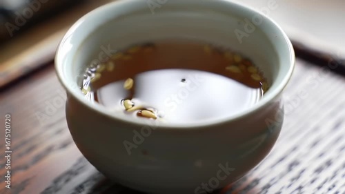 Warm beverage in small bowl close up view