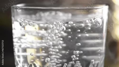 Water splashing in glass close up