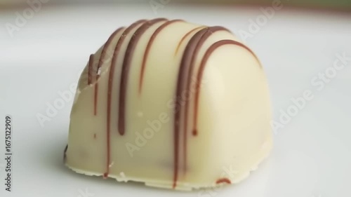 White chocolate truffle with brown chocolate design