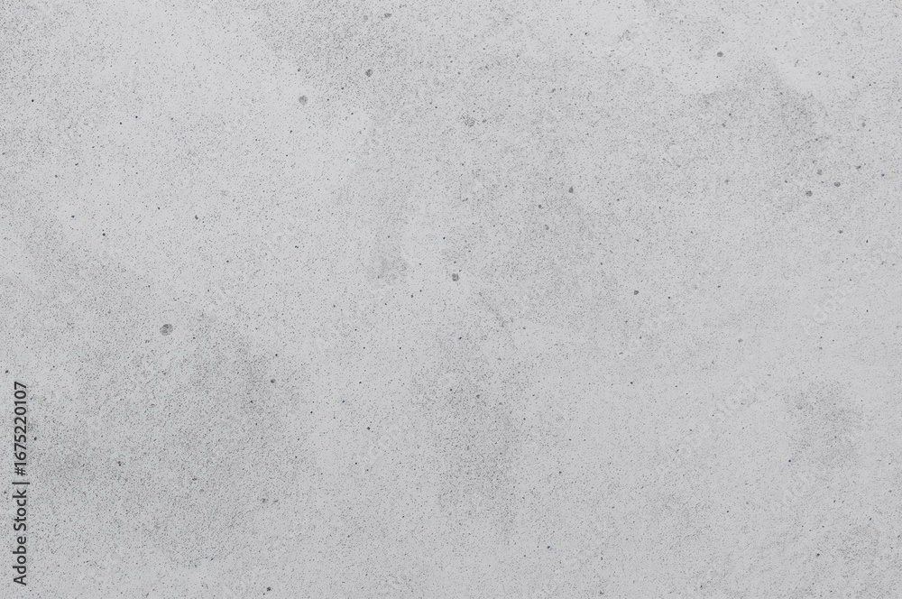 Fototapeta premium Aged concrete surface with subtle grey spots and speckled texture