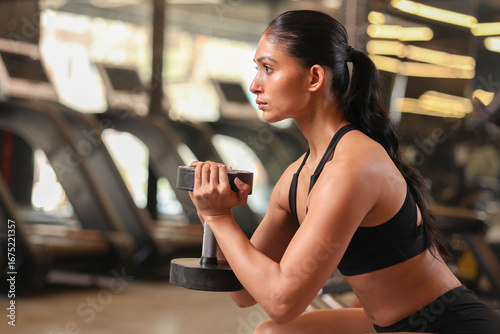 Close Up Of Muscular Woman In Gym Working Out Goblet Squat