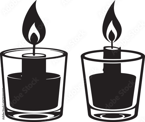 Two lit candles in glass holders silhouette