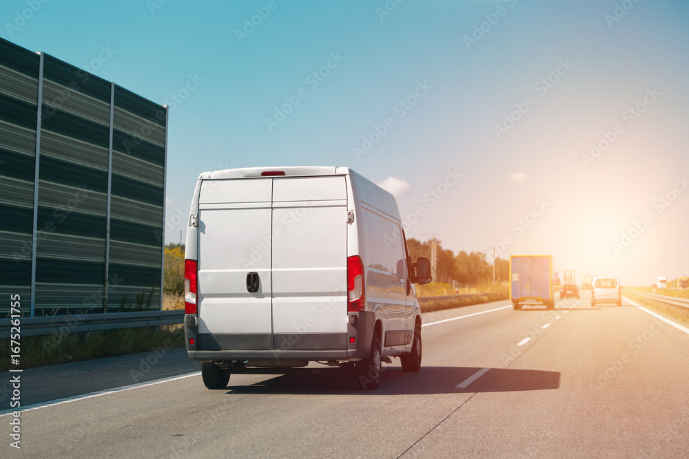 Naklejka premium Cargo van traveling on clear highway