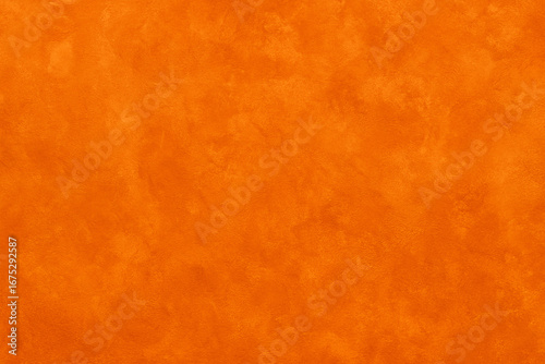 Vivid orange textured background with a subtle rough surface pattern. Ideal for graphic design, digital art, web design, and presentations needing a bold and energetic backdrop.