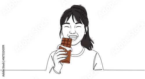 A woman joyfully eating a chocolate bar, enjoying a sweet treat.