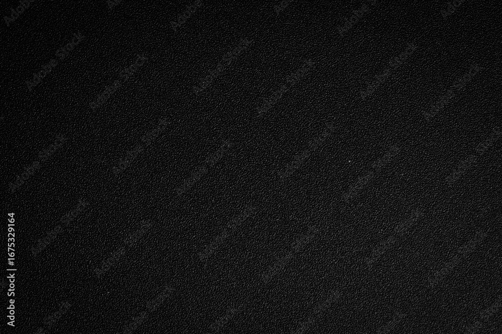Fototapeta premium Black texture background. Textured surface for design or text. Top view. Free space.