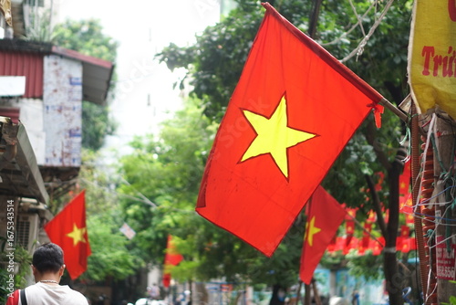 Hanging Vietnamese national flag displayed to celebrate the 80th anniversary of Vietnam National Day, September 2, 2025, marking the historic milestone with the A80 military parade in Hanoi. 