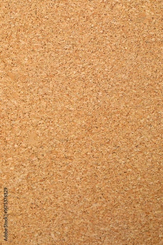 Cork vertical background. Brown yellow color textured cork board background. Natural cork texture. Top view background. High resolution photo. Full depth of field.