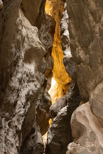 Vertical photo of a mountain range in Saitabat Gorge, Turkey. High resolution image of steep rocky cliffs and green slopes, ideal for travel, nature and landscape backgrounds