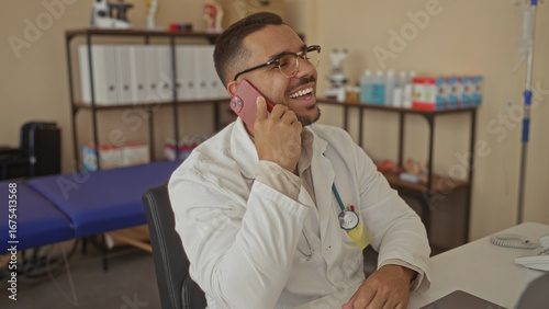 Wallpaper Mural Man in white coat with stethoscope smiling while talking and holding smartphone to ear in clinic; confidence trust care support. Torontodigital.ca