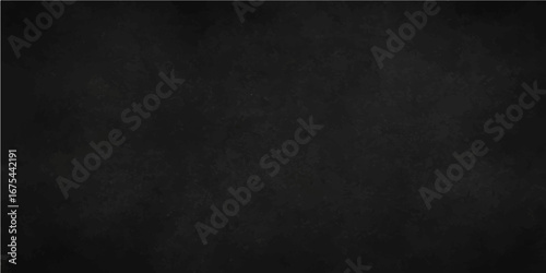 Textured black chalkboard surface with a vintage, grunge wall pattern for a blank and dirty backdrop