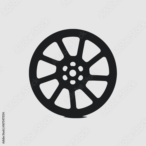 Stylish eight spoke alloy wheel design forming a dark silhouette