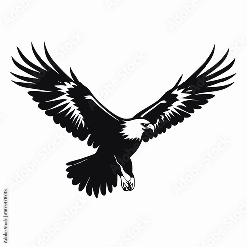 Dramatic graphic American bald eagle with wings spread widely in silhouette