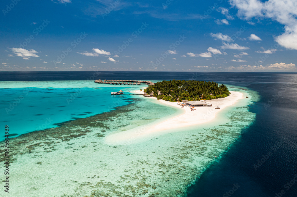 Obraz premium Amazing Maldives. Best aerial landscape with sunny tropical island sunshine blue sea and stunning scenic background perfect summer vacation luxury travel paradise destination top tourism escape