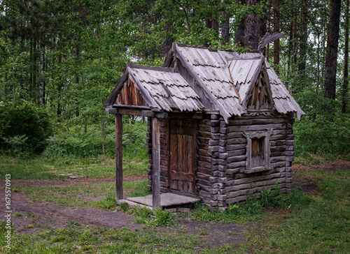 Fairytale wooden house in a summer forest.