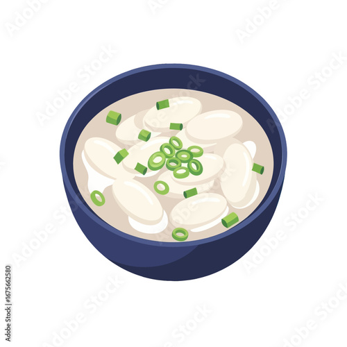 A bowl of steaming, creamy soup is topped with plump, white dumplings and garnished with fresh green onions.