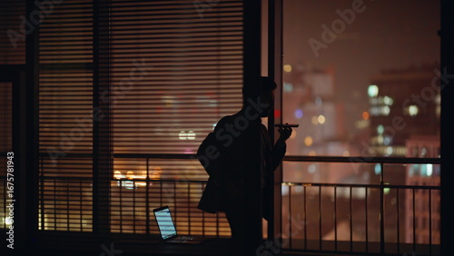 Tableau sur toile Concerned lawyer silhouette talking phone crossing at evening panoramic cabinet