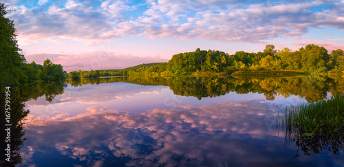 Tranquil Eagleville Pond autumn sunrise at the confluence of the Willimantic River and local brooks in Storrs, Connecticut—a public conservation haven for hiking, fishing, and paddling.