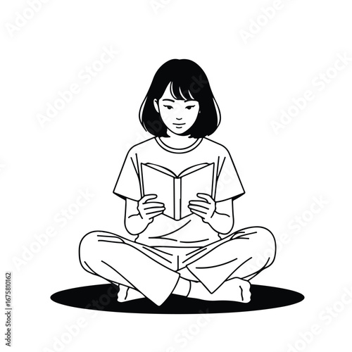 Young woman reading a book while sitting crosslegged on the floor in a minimalist style, creating a peaceful and focused atmosphere.