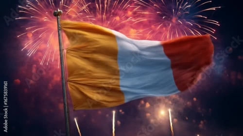 A waving national flag against a spectacular fireworks display.