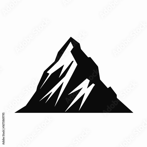 Sharp jagged mountain peak rising against a clean white sky silhouette