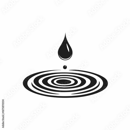 Droplet initiating concentric water ripples on surface creating a captivating silhouette