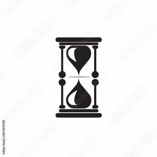 Classic sand timer flowing depicting time passing in black silhouette