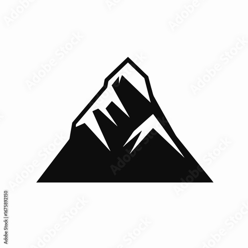Majestic mountain peak with rocky details captured in a dramatic silhouette