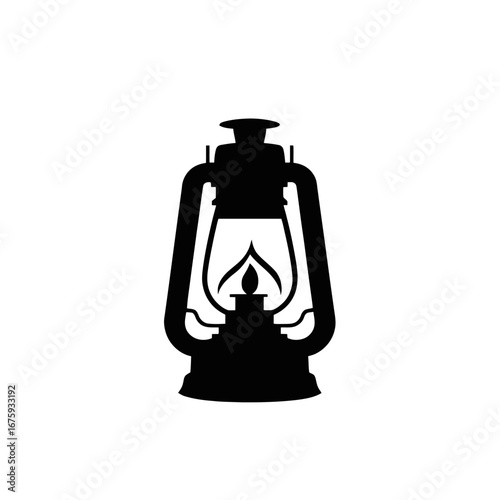 Classic vintage kerosene lantern emitting a bright light within the silhouette