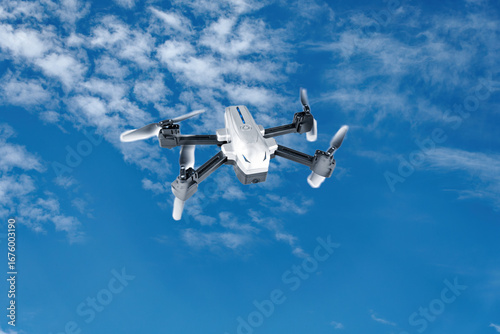 This image shows a quadcopter UAV in front view, with a blue sky in the background