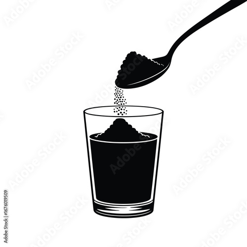Spoonful of dark powder being poured into a glass of dark liquid