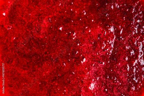 Texture of lingonberry jam of rich red color close-up.