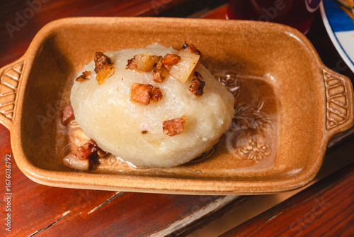 Fototapeta Naklejka Na Ścianę i Meble -  Kartacz (also cepelin) with minced meat - a regional dish popular in northeastern Poland in Warmia and Mazury