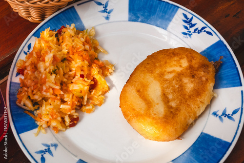 Fototapeta Naklejka Na Ścianę i Meble -  Farszynka - stuffed potato cutlets, a Polish delicacy from Warmia and Mazury. Potato dough filled with meat and vegetables.