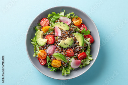 delicious clean eating bowl featuring creamy avocado resting on bed of buckwheat topped with array of fresh