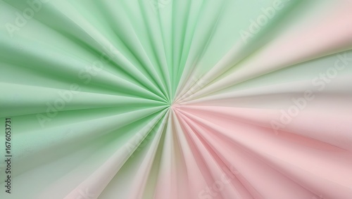 Abstract radial pattern of folded green and pink fabric with soft gradation effect