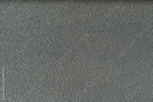 細かい小石の壁面のクローズアップ。背景・テクスチャ素材