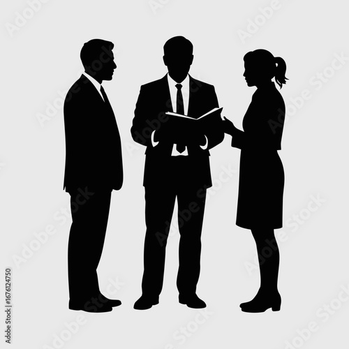 Three business professionals in silhouette discussing a document together