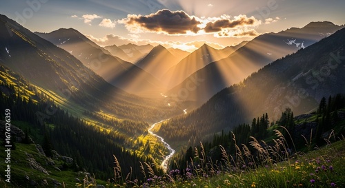 Fototapeta Naklejka Na Ścianę i Meble -  Sunbeams streaming through mountain valleys at sunset, illuminating the landscape