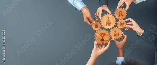 Canvastavla Diverse hands gather around wooden gears, symbolizing unity and collaboration in achieving business success, emphasizing teamwork, leadership, and goal orientation in a modern setting