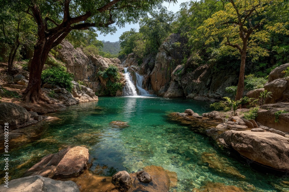Fototapeta premium Lush waterfall cascading into a tranquil pool