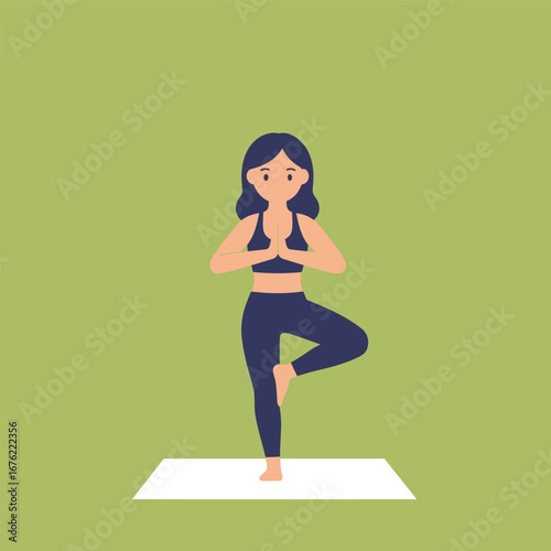 Woman in Tree Pose on Yoga Mat Dark Blue Outfit.